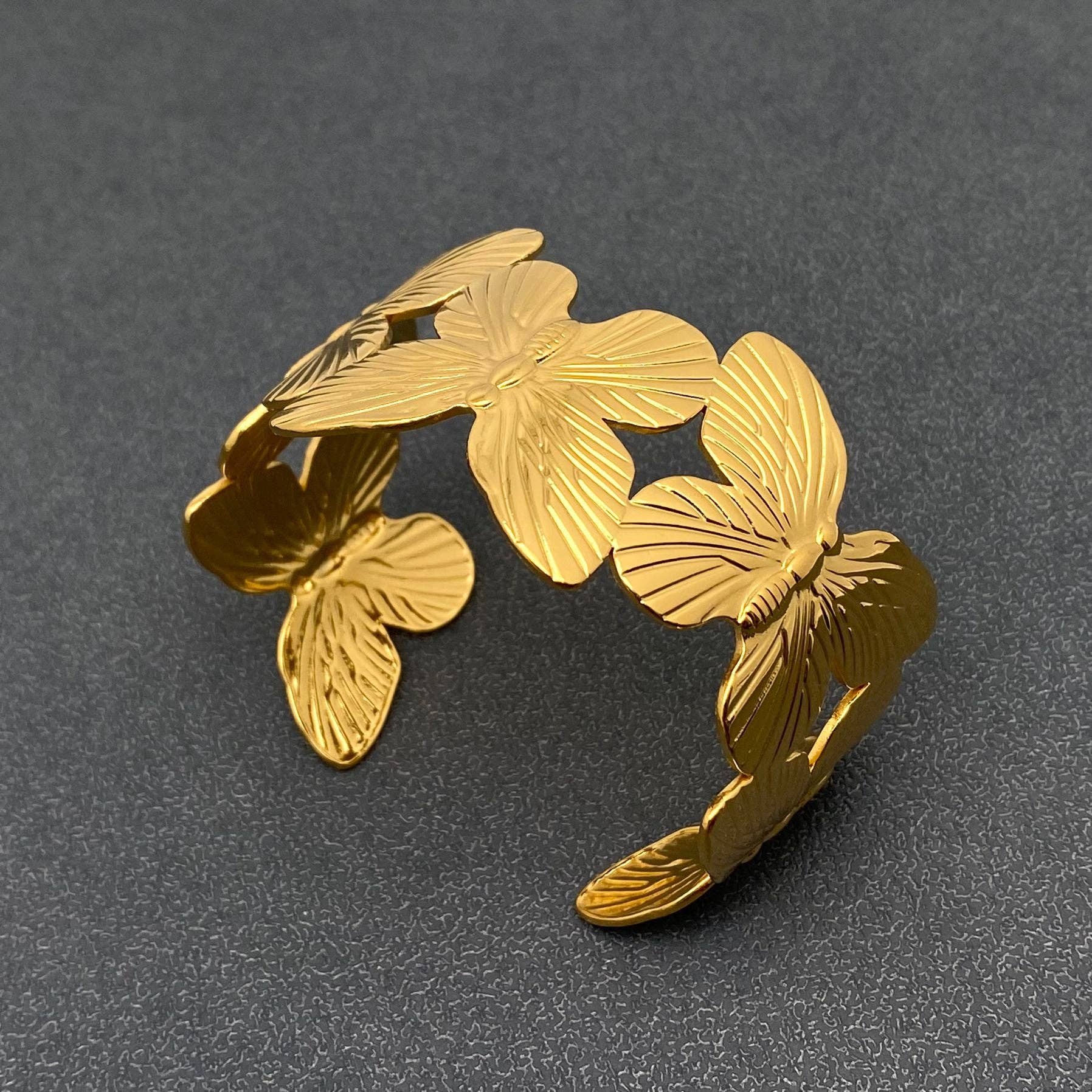 gold butterfly motif cuff