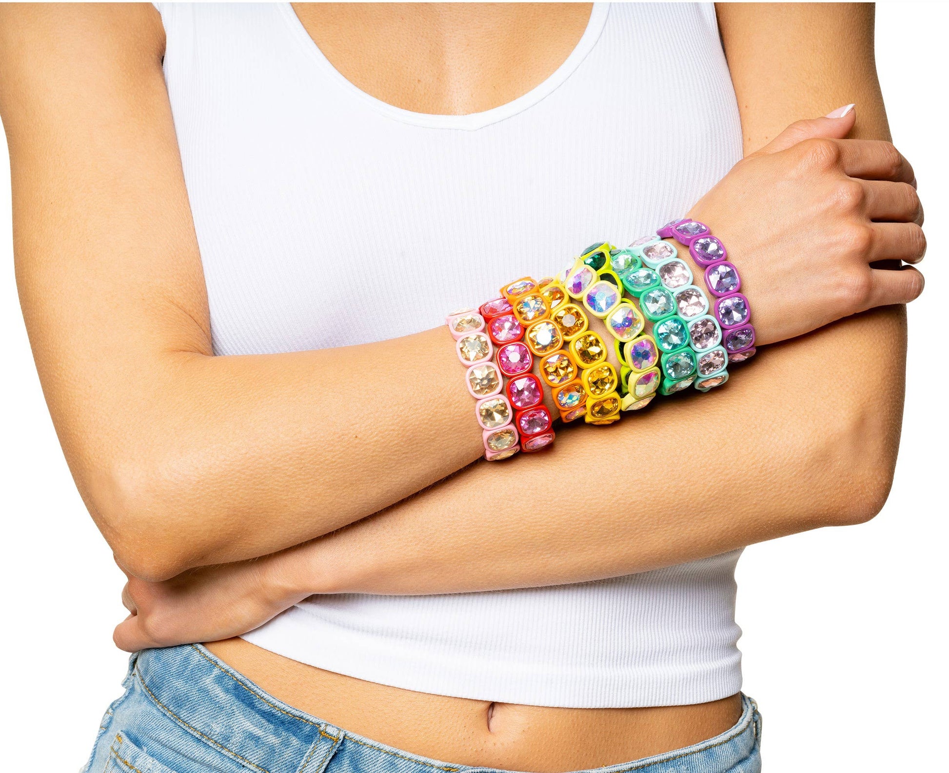 woman in white tank top wearing crystal bracelets in multiple colors