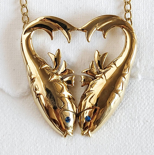 gold double fish heart shaped necklace with inlaid Aquamarine stones for the eyes