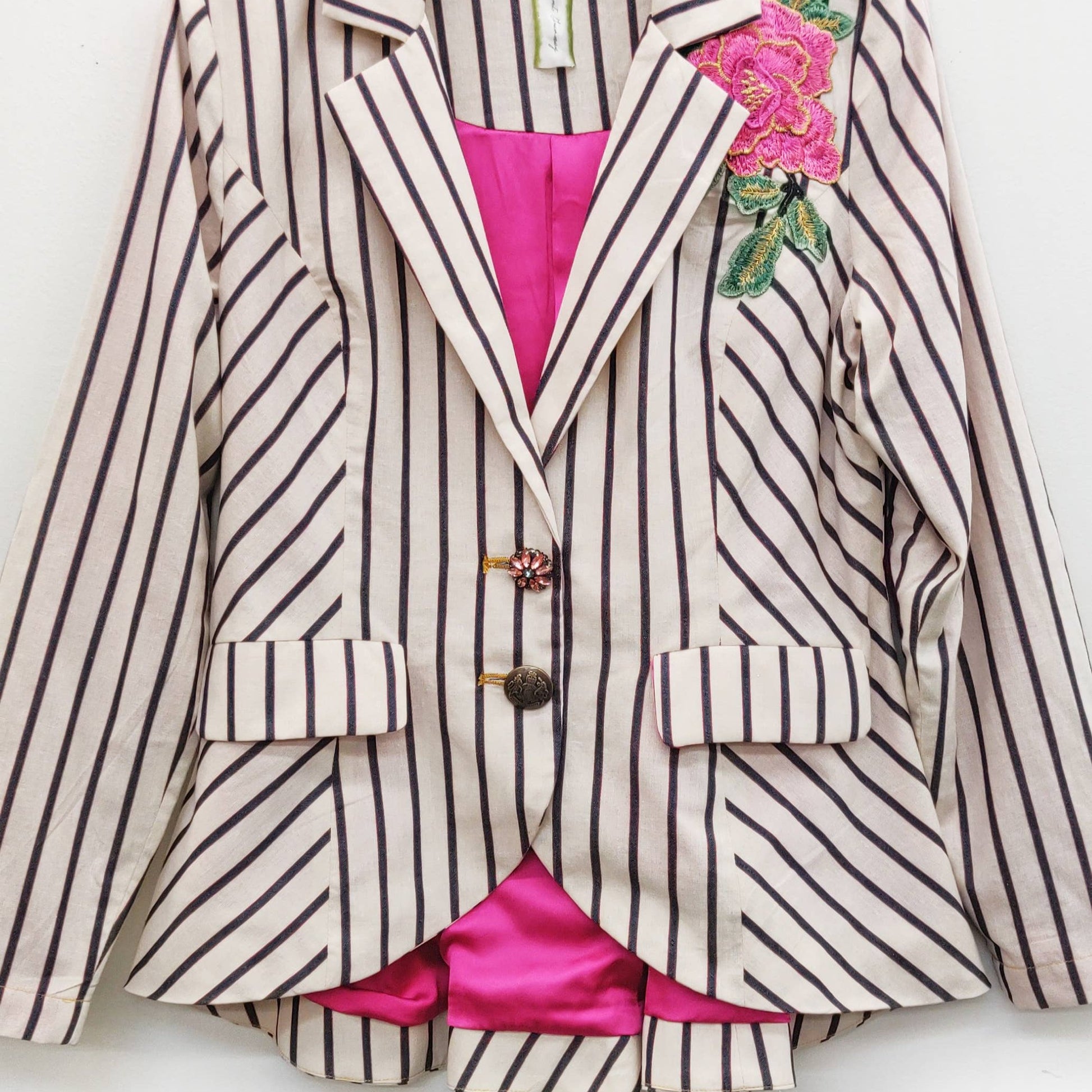 black and cream striped blazer with pink lining, front view