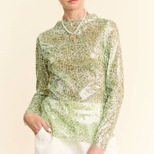 woman wearing green sequin top